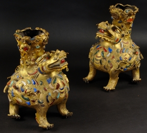 Pair of Chinese Jeweled Gilt Bronze Foo Dogs, 19th c., sold for $143,750