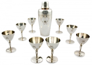4. Tiffany &amp; Co. sterling silver cocktail service consisting of cocktail shaker with strainer and jigger cap, marked 2 Pints, 22422 L; and eight matching cups marked 18885 L. Set comes with original fitted box.