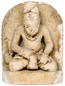 Lot 412. Indian Sandstone Carving of Seated Deity, Kubera, 11th-12th C.