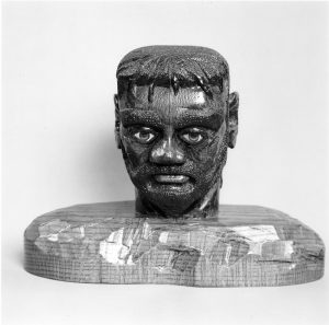 8. In addition to carving canes, Mr. Jews also sculpted a few larger pieces, including this painted and varnished bust. Roland L. Freeman, © 2001. Reprinted with permission of the artist.